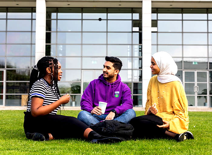 International students relaxing on the grounds of University College Dublin Study in Ireland